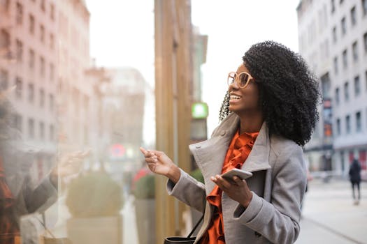 Happy woman with curly hair shopping in the city, reflecting joy and a trendy lifestyle.